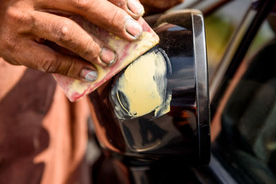 Close-up of man holding drink