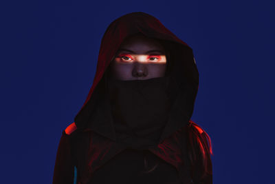 Low angle view of woman standing against clear sky