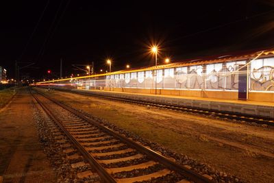 View of railroad tracks at night