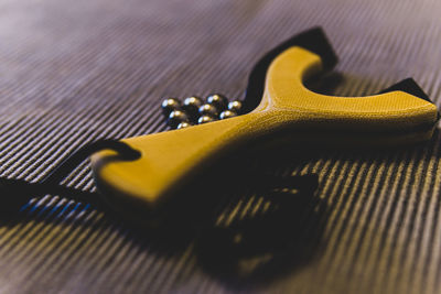 Close-up of guitar on table