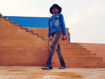 Boy standing on stairs