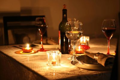 Close-up of wine glasses on table