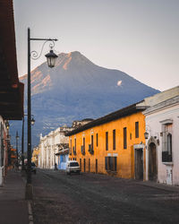 Street amidst buildings against sky