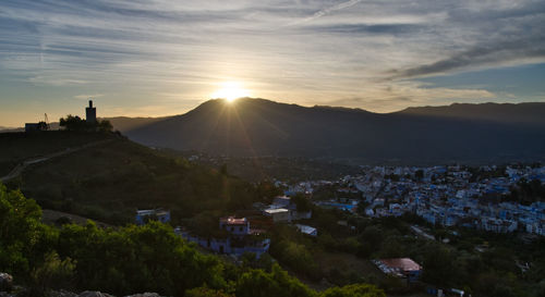 High angle shot of townscape against sky at sunset