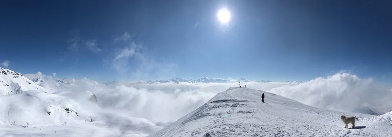 Low angle view of snowcapped mountains against sky