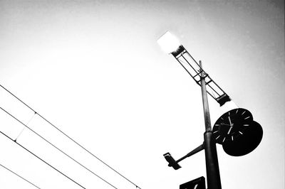 Low angle view of street light against clear sky