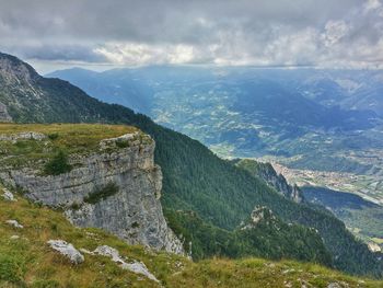 Scenic view of mountains against cloudy sky