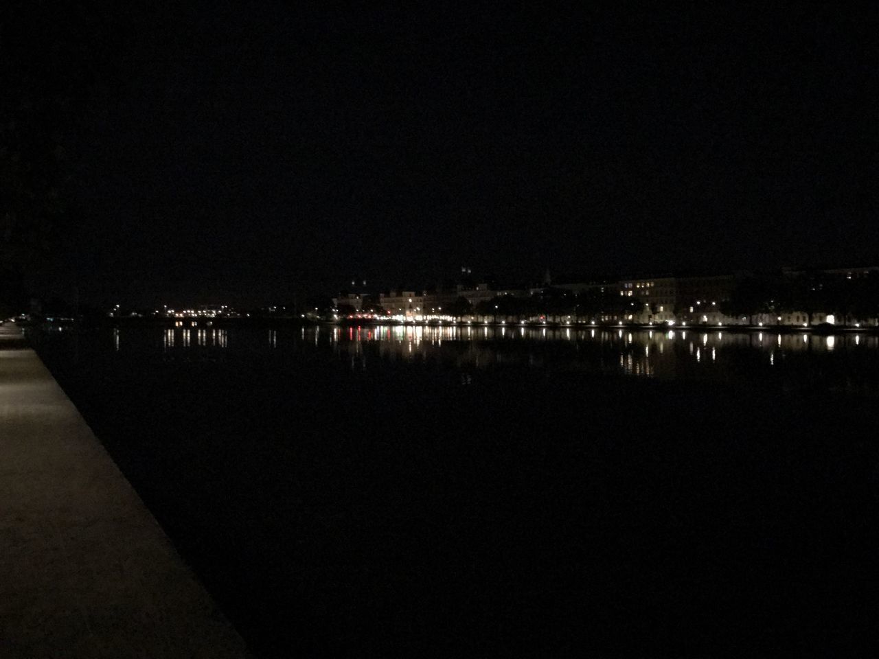 ILLUMINATED CITY AGAINST SKY AT NIGHT