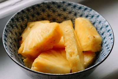 Close-up of chopped pineapple in bowl