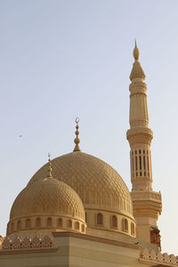 Low angle view of mosque against clear sky