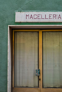 Text on closed door of building