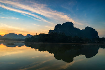 Morning of nong thale in krabi, thailand. beautiful reservoir and limestone mountains at sunrise