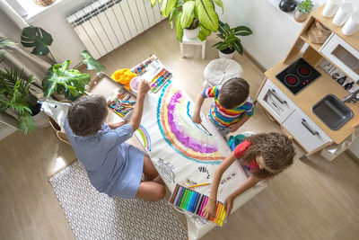 High angle view of woman using laptop on table