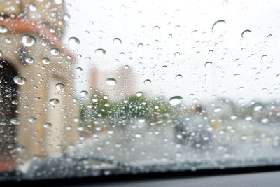 Close-up of raindrops on glass window