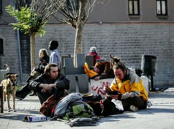 People sitting in front of building