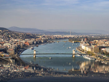 High angle view of river and buildings in city