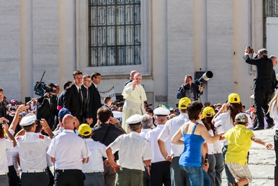 Group of people standing outside building