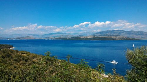 Scenic view of sea against blue sky