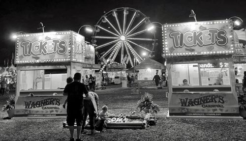 Rear view of people at amusement park