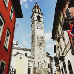 Low angle view of bell tower against sky