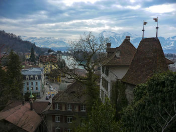 Buildings in town against sky