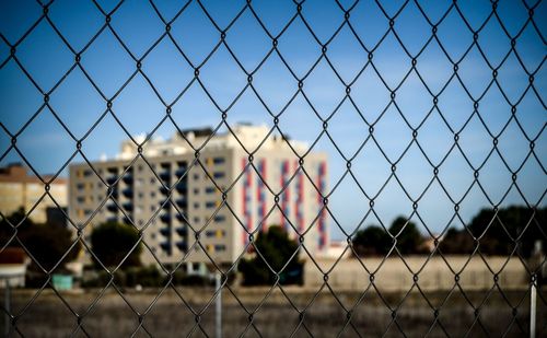 Chainlink fence seen through chainlink fence