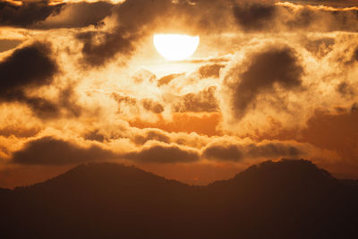 Low angle view of dramatic sky during sunset