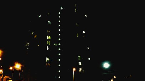 Low angle view of illuminated building at night