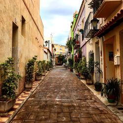 Narrow alley amidst buildings in city