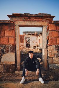 Portrait of man sitting outdoors