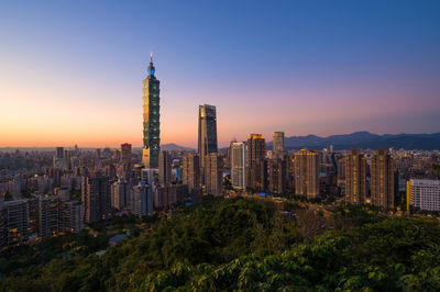 Modern buildings in city against sky