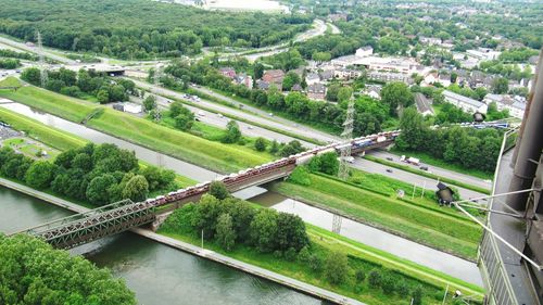 High angle view of railway bridge over river in city