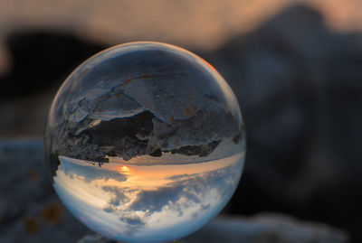 Close-up of crystal ball against blurred background