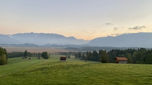 Scenic view of landscape and mountains against sky