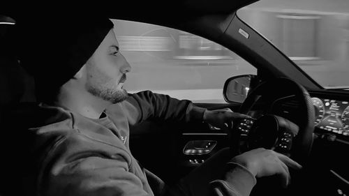 Portrait of man driving car