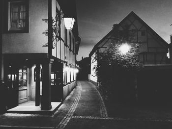 Street lights in city at dusk