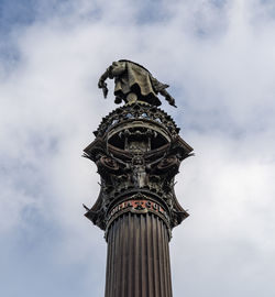 Low angle view of statue of liberty against sky