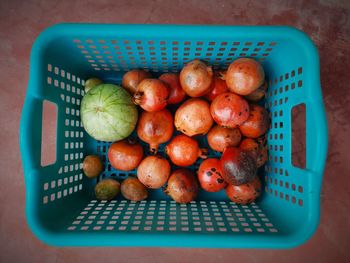 High angle view of apples in basket on table