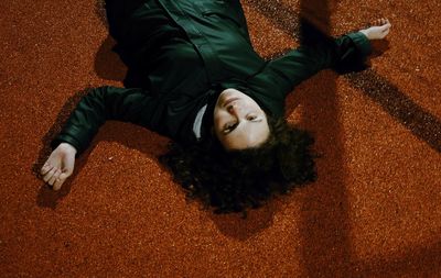 High angle view of baby sleeping on carpet