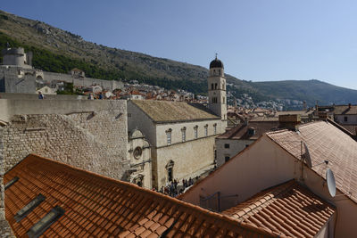 High angle view of buildings in town against sky