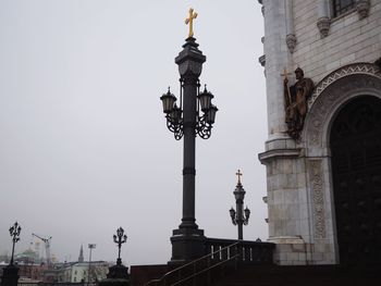 Low angle view of statue of building against sky