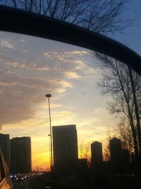 Silhouette of city during sunset