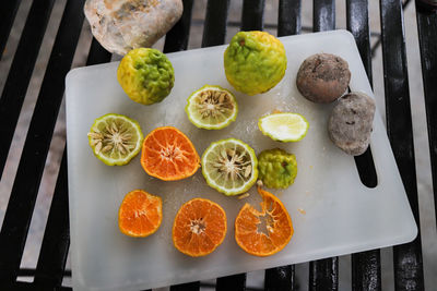 High angle view of fruits and vegetables on cutting board