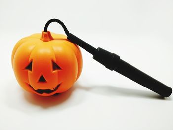 Close-up of pumpkin against orange background