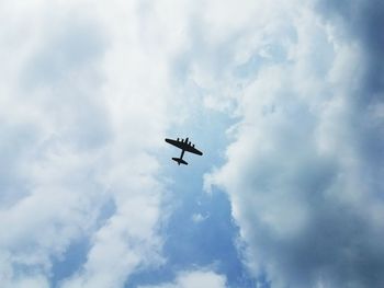 Low angle view of airplane flying in sky