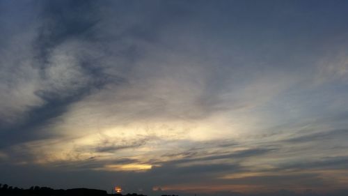 Low angle view of dramatic sky during sunset