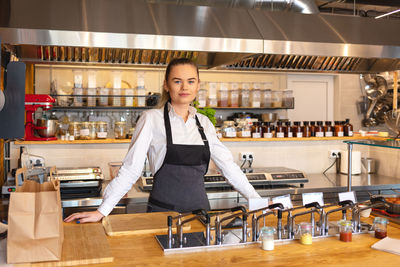 Portrait of woman working in restaurant