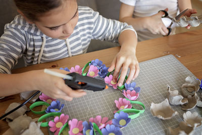 High angle view of child playing with toy blocks on table