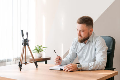 Young man using laptop at home