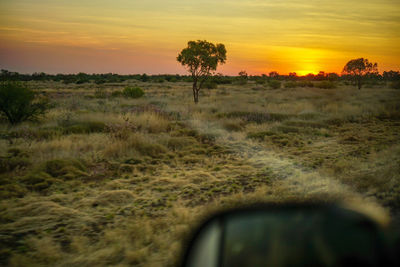 Scenic view of land against sky during sunset